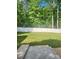 Level, green backyard surrounded by a white wooden privacy fence at 2025 Kisatchie Dr, Hickory Grove, SC 29717