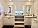 Modern bathroom with matching double vanities and large decorative mirrors at 2025 Kisatchie Dr, Hickory Grove, SC 29717