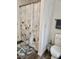 Clean bathroom with a floral shower curtain, and essential toiletries at 2025 Kisatchie Dr, Hickory Grove, SC 29717