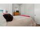 Bright bedroom with a plush bed, wooden dresser, and minimalist decor, creating a calming atmosphere at 2518 Marshall Pl, Charlotte, NC 28203