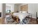 Serene bedroom with an ornate headboard, a patterned rug, and ample natural light, providing a cozy retreat at 2518 Marshall Pl, Charlotte, NC 28203