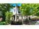 Townhome with lush landscaping, a wrought-iron fence, and a cozy front porch at 2518 Marshall Pl, Charlotte, NC 28203