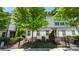 Neutral-toned townhome with a wrought-iron fence and lush landscaping at 2518 Marshall Pl, Charlotte, NC 28203