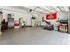 Neat two-car garage with epoxy flooring, a sports flag, and lots of storage space at 2518 Marshall Pl, Charlotte, NC 28203