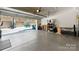 Garage view showcasing an epoxy floor and open garage door with outside view and ample space at 2518 Marshall Pl, Charlotte, NC 28203