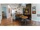 View of the kitchen from the living area with a wooden breakfast table at 2518 Marshall Pl, Charlotte, NC 28203