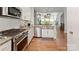 Bright kitchen with an island, stainless steel appliances, and lots of counter space at 2518 Marshall Pl, Charlotte, NC 28203