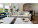 Living room boasts comfortable seating, a staircase, lots of light from the many windows at 2518 Marshall Pl, Charlotte, NC 28203