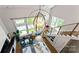 Sun-lit living room boasting high ceilings, modern lighting, and comfortable furnishings, perfect for relaxation and entertaining at 2518 Marshall Pl, Charlotte, NC 28203