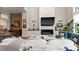 Living room view boasts a fireplace, decor, access to kitchen, and many windows at 2518 Marshall Pl, Charlotte, NC 28203