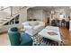 Living room has a staircase, modern furniture, decor, and opens into the kitchen at 2518 Marshall Pl, Charlotte, NC 28203