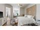 Bright bedroom with an ornate headboard, with ensuite bathroom, providing a serene retreat at 2518 Marshall Pl, Charlotte, NC 28203