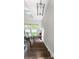 Wooden staircase with unique railing, complemented by natural light from multiple windows, creating an inviting space at 2518 Marshall Pl, Charlotte, NC 28203