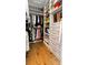 Organized walk-in closet with custom shelving and hardwood flooring for ample storage at 2518 Marshall Pl, Charlotte, NC 28203