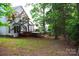 View of the backyard with a deck and hot tub offering relaxation and entertainment opportunities at 2608 Yarrow Rd, Charlotte, NC 28213