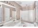 Standard bathroom with double sink vanity, combination shower and tub, and tiled floors at 2608 Yarrow Rd, Charlotte, NC 28213