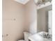 Neutral bathroom featuring a modern vanity, updated fixtures, and a clean, minimalist design at 2608 Yarrow Rd, Charlotte, NC 28213