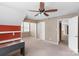 This spacious bedroom has a ceiling fan and multiple doors at 2608 Yarrow Rd, Charlotte, NC 28213