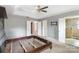 Bright bedroom featuring neutral walls, a ceiling fan, and an ensuite bathroom for added convenience at 2608 Yarrow Rd, Charlotte, NC 28213
