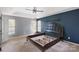 Spacious bedroom with a ceiling fan and two large windows providing plenty of natural light at 2608 Yarrow Rd, Charlotte, NC 28213