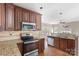 Well-equipped kitchen with stainless steel appliances, granite countertops, and hardwood floors, open to the living area at 2608 Yarrow Rd, Charlotte, NC 28213