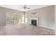 Cozy living room with a fireplace and large windows offering natural light at 2608 Yarrow Rd, Charlotte, NC 28213