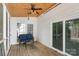 Relaxing screened-in porch with a ceiling fan, a wicker couch, and a view of the backyard at 2608 Yarrow Rd, Charlotte, NC 28213