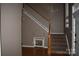 Interior shot of the home's foyer with staircase featuring wooden steps and white railing at 2608 Yarrow Rd, Charlotte, NC 28213