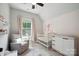 Serene Bedroom with soft pink accents, chair, and plenty of natural light at 2637 Springway Dr, Charlotte, NC 28205