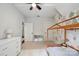 Bright bedroom showcasing a wooden bed frame, plush white carpet and a lovely illustrated wallpaper at 2637 Springway Dr, Charlotte, NC 28205