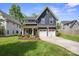 Charming two-story home with a well-manicured lawn and a two-car garage at 2637 Springway Dr, Charlotte, NC 28205