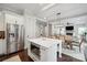Stainless steel appliances and white island open to dining and living areas at 2637 Springway Dr, Charlotte, NC 28205