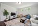 Spacious living room with modern decor, ample natural light, and a playful ' area at 2637 Springway Dr, Charlotte, NC 28205