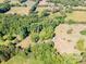 Aerial view of a property showing the houses surrounded by green trees and grassy areas at 290 Glenmere Ln, Mooresville, NC 28115