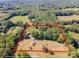An aerial shot showcases the property's expansive land, potential homesites, and tree coverage at 290 Glenmere Ln, Mooresville, NC 28115