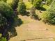 Aerial view of a large lot with a partial fence line and overhead power lines at 290 Glenmere Ln, Mooresville, NC 28115