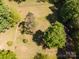 Aerial view of the property showing the flat, cleared land and surrounding mature trees at 290 Glenmere Ln, Mooresville, NC 28115