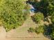 Aerial view of home and lush trees offers privacy and a serene environment, perfect for nature lovers at 290 Glenmere Ln, Mooresville, NC 28115