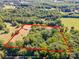Aerial view of tree-covered land that shows expansive property boundaries, perfect for building at 290 Glenmere Ln, Mooresville, NC 28115