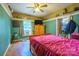 Unique bedroom with warm wood floors, tongue and groove walls, and a ceiling fan at 290 Glenmere Ln, Mooresville, NC 28115