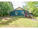 Charming home featuring a unique exterior with mature trees and a welcoming front entrance at 290 Glenmere Ln, Mooresville, NC 28115