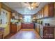 Charming country kitchen with wooden cabinets, farmhouse sink, and hardwood floors at 290 Glenmere Ln, Mooresville, NC 28115