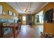 Rustic living room with wood-burning stove, hardwood floors, and farmhouse decor at 290 Glenmere Ln, Mooresville, NC 28115