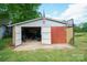 View of exterior shed with open bay doors, open bay, and a basketball hoop at 290 Glenmere Ln, Mooresville, NC 28115
