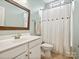 Bathroom featuring a white vanity, a framed mirror, and a shower with a curtain at 3068 Streamhaven Dr, Lancaster, SC 29707