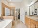 Bathroom with a glass enclosed shower and garden tub with double vanity at 3068 Streamhaven Dr, Lancaster, SC 29707