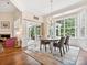 Elegant dining room with a fireplace, chandelier, and sliding glass doors at 3068 Streamhaven Dr, Lancaster, SC 29707