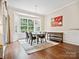 Bright dining room with a chandelier, bay window, and hardwood floors at 3068 Streamhaven Dr, Lancaster, SC 29707