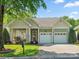 Charming home with a well-manicured lawn, a two-car garage, and beautiful landscaping at 3068 Streamhaven Dr, Lancaster, SC 29707