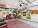 Well organized garage with ample storage, shelving, and a vibrant red rug at 3068 Streamhaven Dr, Lancaster, SC 29707